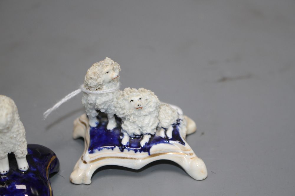 Five Staffordshire porcelain toy groups of poodles, c. 1840-50, the majority by Dudson, H. 4.2 - 5.2cm